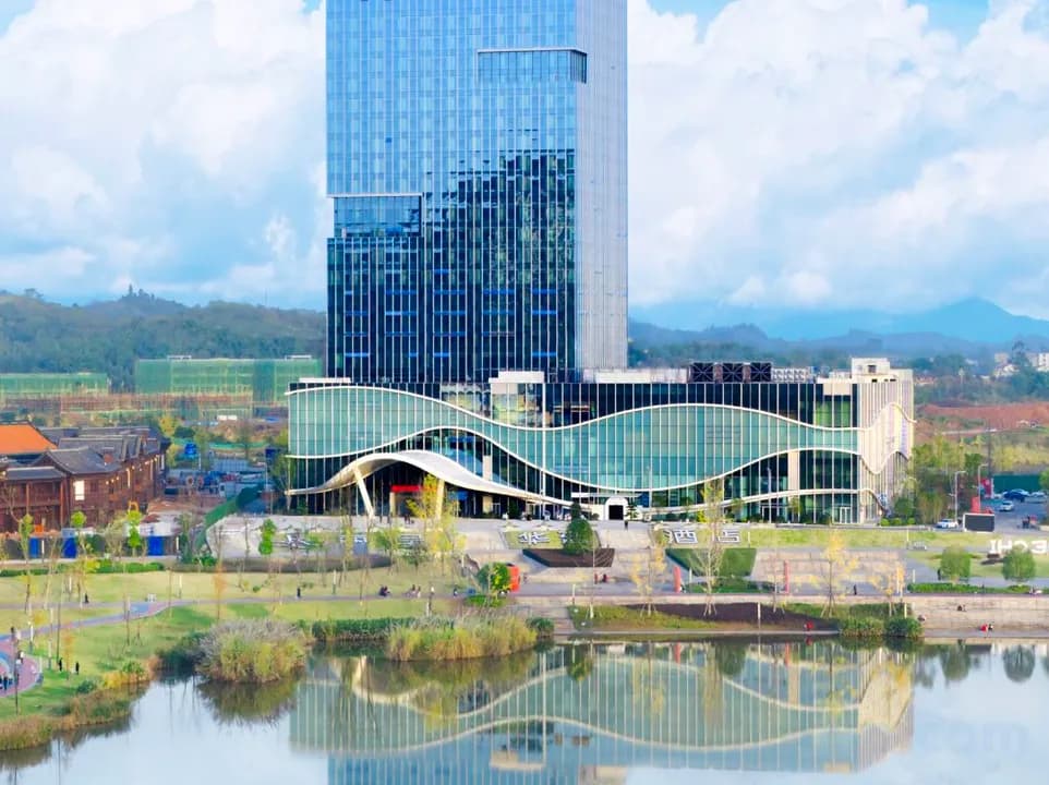 Grand Rezen reflected in a lake during the day